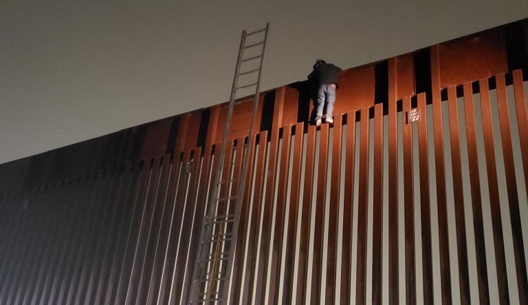 Smugglers leave man stranded atop southern border’s 30-foot wall