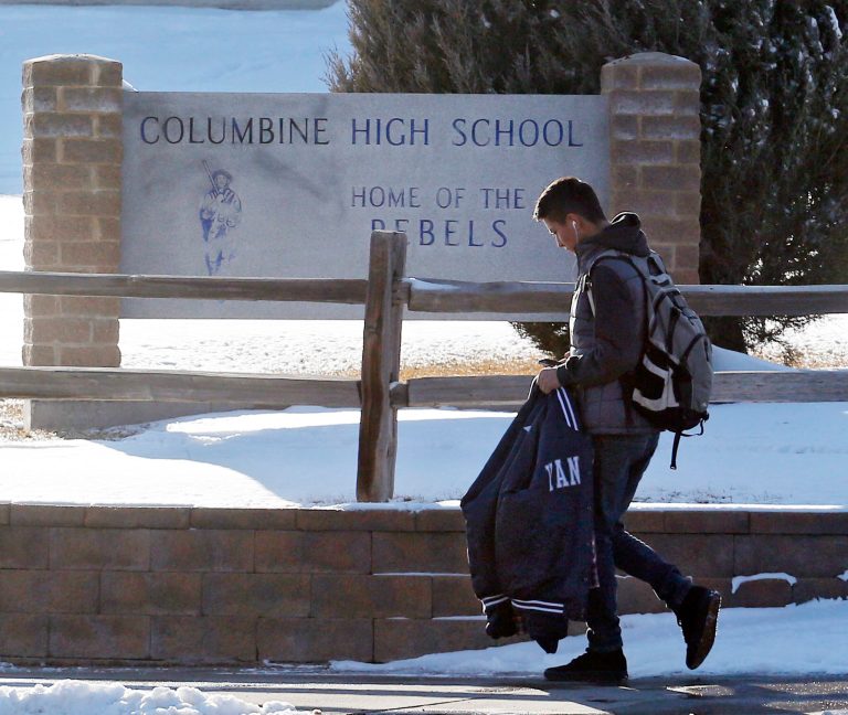 A student leaves Columbine High School in Littleton, Colo., on Thursday, Jan. 23, 2014. (AP Photo/Ed Andrieski)