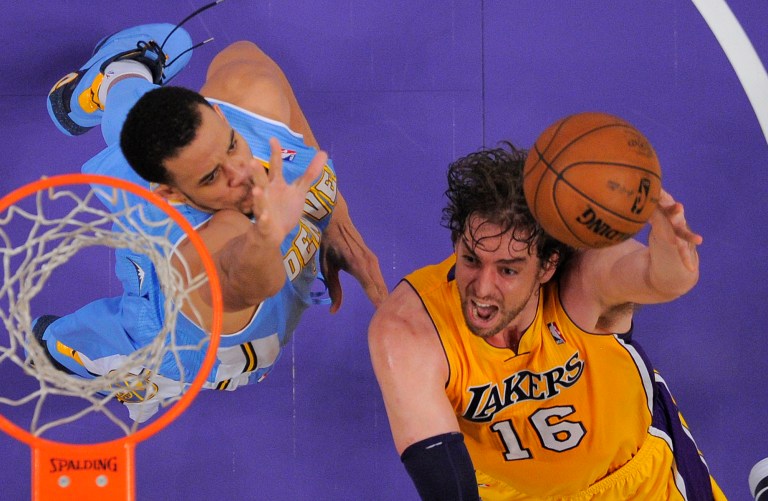   Los Angeles Lakers forward Pau Gasol, right, of Spain, puts up a shot as Denver Nuggets center JaVale McGee defends during the second half of their NBA basketball game, Friday, Nov. 30, 2012, in Los Angeles, Calif. The Lakers won 122-103. (AP Photo/Mark J. Terrill)  