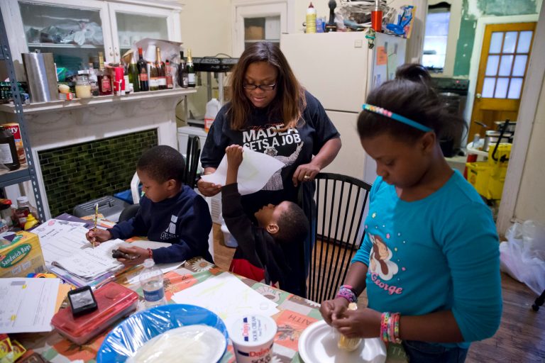Families already buffeted by difficult economic times will see their food stamps benefits drop Nov. 1 as money allocated by the 2009 federal stimulus plan runs out. The average family of four will see benefits drop by $36 a month. (AP/Matt Rourke)