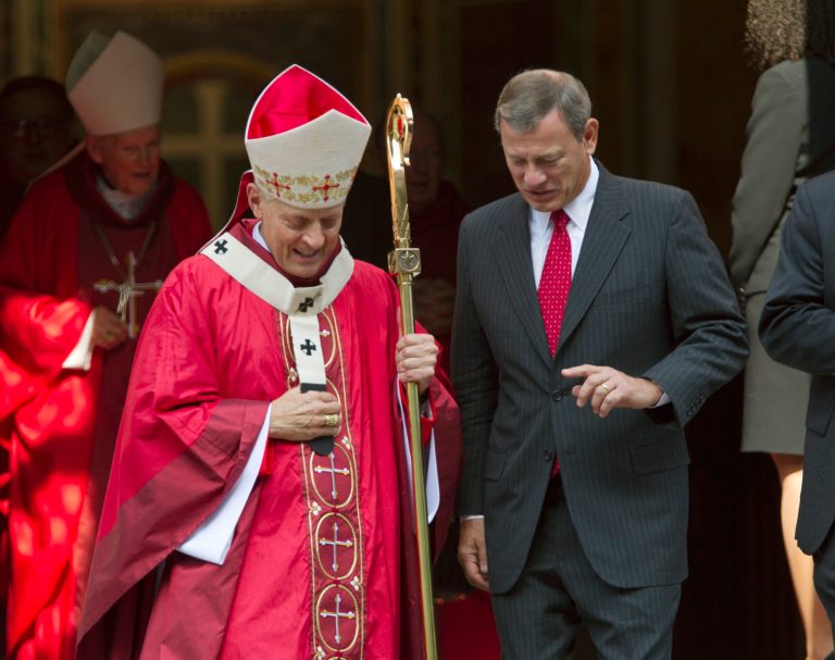Cardinal Donald Wuerl walk with U.S. Supreme Court Chief Justice John Roberts as they leave the church, after the Red Mass at Cathedral of St. Matthew the Apostle in Washington on Sunday, Oct. 6, 2013. The Supreme Court's new term starts tomorrow, Monday, Oct. 7. (AP Photo/Jose Luis Magana)