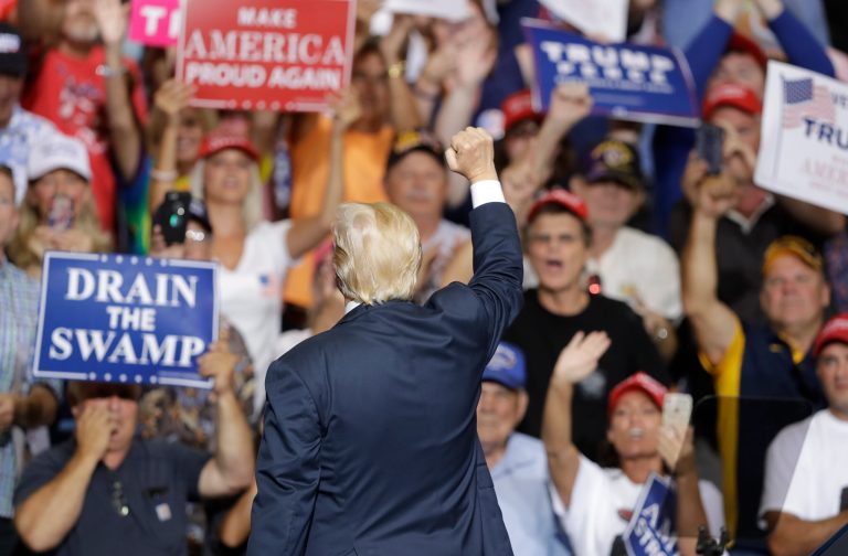 President Donald Trump reacts during a rally Thursday, Aug. 3, 2017, in Huntington, W.Va. Rural America and the president's base are sticking with Trump. (AP Photo/Darron Cummings)