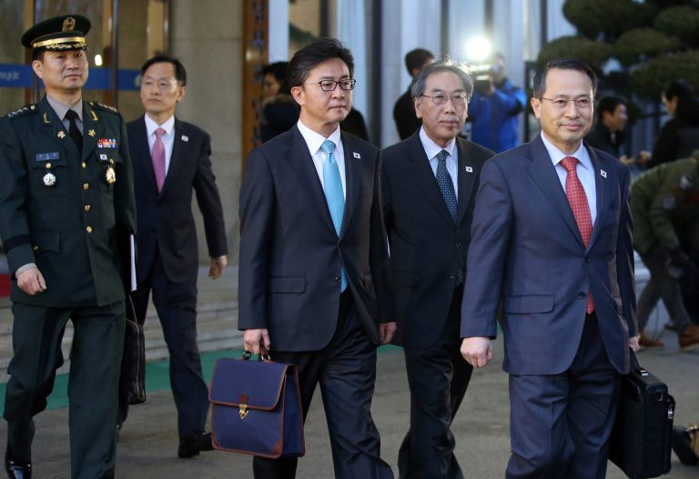 South Korean delegates leave for the border village of the Panumjom to meets their North Korean counterpart, at the Office of the South Korea-North Korea Dialogue in Seoul, South Korea, Wednesday, Feb. 12, 2014. Senior officials from the rival Koreas met Wednesday at the border village, their highest-level talks in years and a potential signal that Pyongyang wants better ties and the resumption of lucrative cooperative projects.(AP Photo/Yonhap, Kim Ju-song)  KOREA OUT