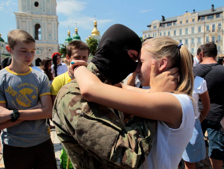 A girl says goodbye to her friend, a volunteer, before they were sent to the eastern part of Ukraine to join the ranks of special battalion 