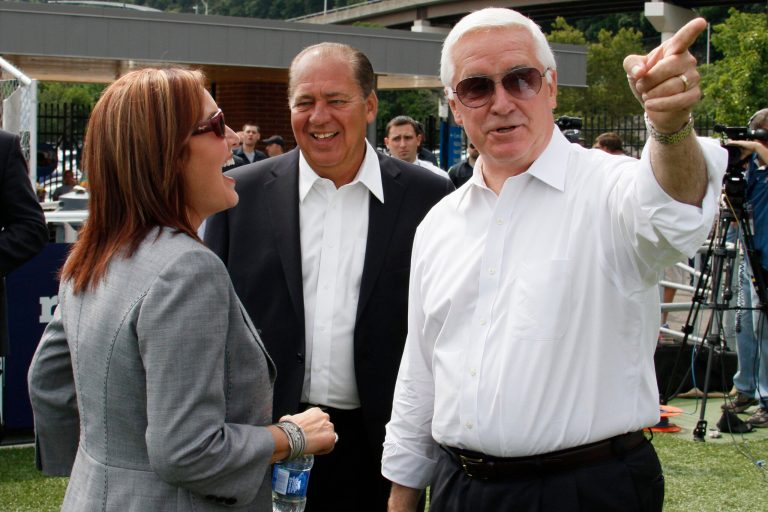 Pennsylvania Governor Tom Corbett, right, visits with West Virginia Governor Earl Ray Tomblin, center, and Ohio Lt. Governor Mary Taylor while attending a rally to support American energy and jobs in the coal and related industries at Highmark Stadium in downtown Pittsburgh, Wednesday, July 30, 2014. The rally is being held the day before the Environmental Protection Agency conducts public hearings on its new emissions regulations for existing coal fired power plants. (AP Photo/Gene J. Puskar)
