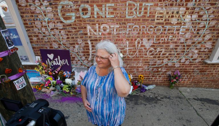 Susan Bro, mother of Heather Heyer who was killed during last year's Unite the Right rally, speaks with reporters at the spot where her daughter was killed in Charlottesville, Va.
