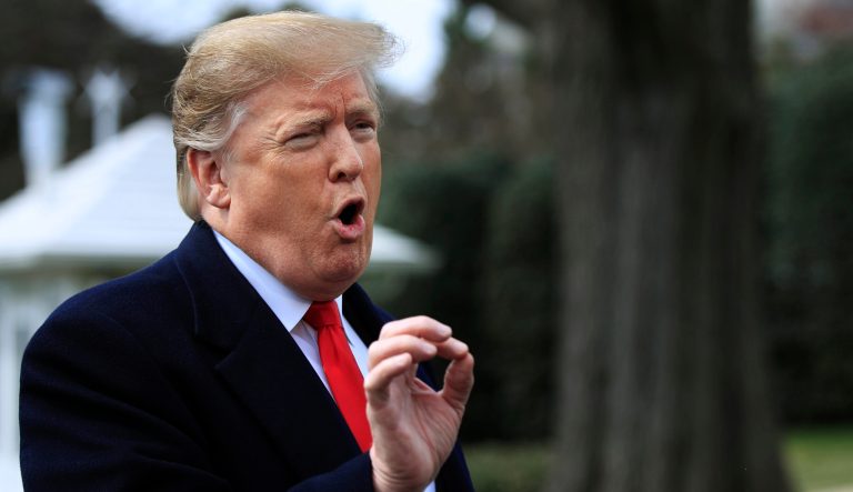 President Donald Trump speaks to reporters before leaving the White House in Washington.