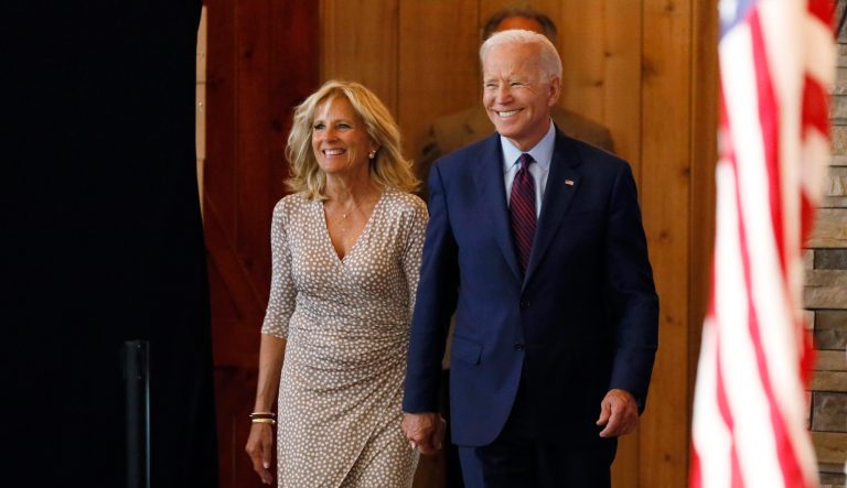 Democratic presidential candidate former Vice President Joe Biden arrives with his wife Jill to speak at a community event.