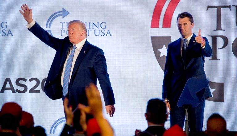 President Donald Trump is joined on stage with Turning Point USA Founder Charlie Kirk as he finishes speaking at Turning Point USA Teen Student Action Summit.