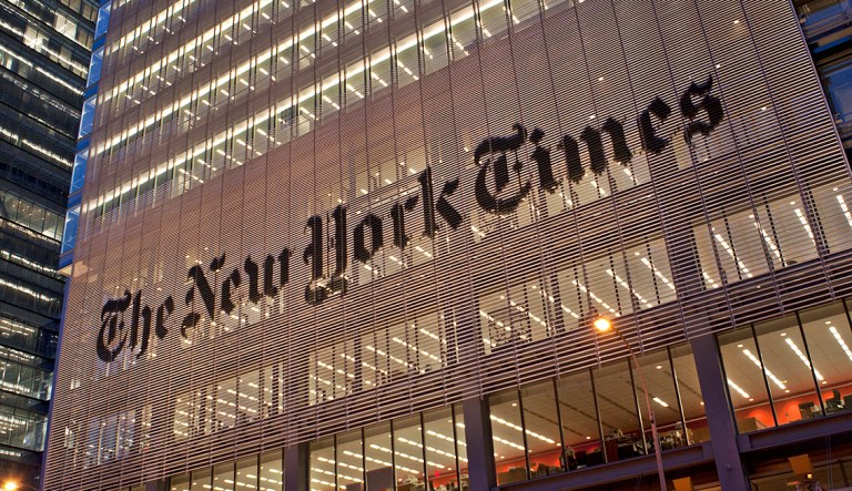 An evening view of the facade of the New York Times Building in Manhattan