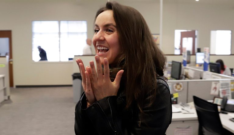 Pittsburgh Post Gazette photographer Stephanie Strasburg reacts in the paper's downtown Pittsburgh newsroom after it was announced that the paper's staff coverage of the shooting at the Tree of Life Synagogue was awarded the Pulitzer Prize for Breaking News Reporting.