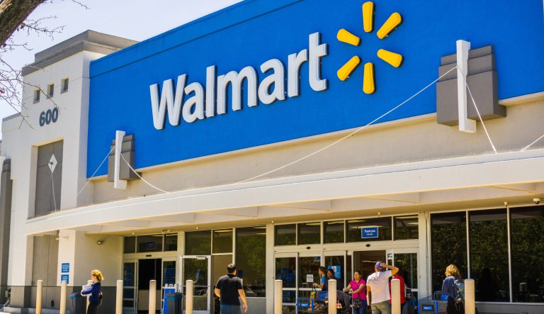 People going in and coming out of a Walmart store 