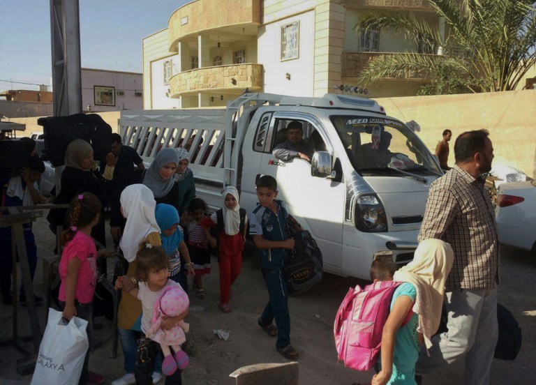 Civilians fled their hometown of Ramadi, the capital of Iraq's Anbar province, 115 kilometers (70 miles) west of Baghdad, Monday, May 18, 2015. (AP Photo)
