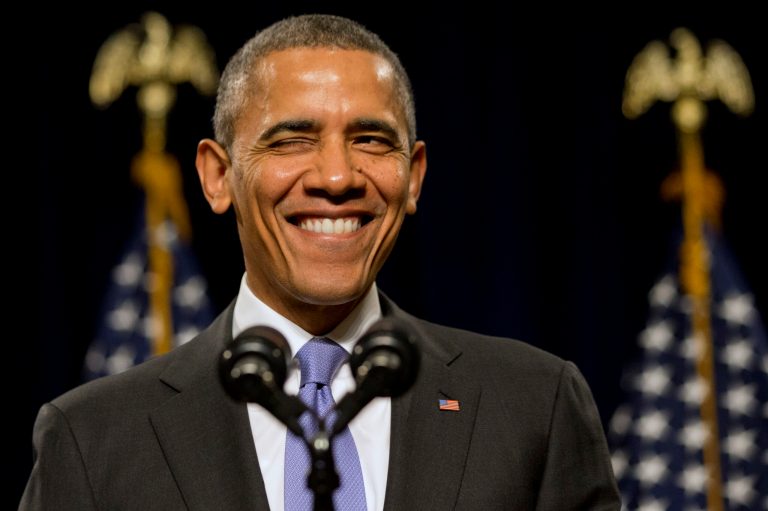 President Obama winks as he is welcomed before speaking to the House Democratic Issues Conference in Cambridge, Md., on Feb. 14. The president said top priorities for Congress should be increasing the minimum wage and reforming immigration. (AP Photo/Jacquelyn Martin)