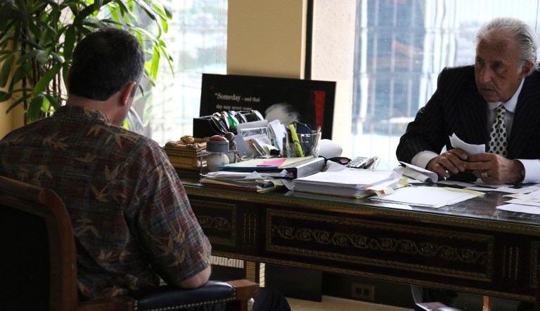 Honolulu attorney Michael Green, right, sits with his client, the former Hawaii Emergency Management Agency employee who sent a false missile alert to residents and visitors in Hawaii, left, during an interview with reporters on Friday. The ex-state employee says he's devastated about causing panic, but he believed it was a real attack at the time. The man in his 50s spoke to reporters Friday on the condition he not be identified because he fears for his safety after receiving threats. (AP Photo/Jennifer Sinco Kelleher)
