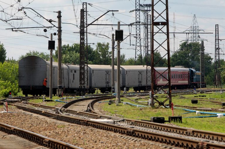 A refrigerated train loaded with bodies of the passengers of Malaysian Airlines flight MH17 departs Kharkiv railway station, Ukraine, Tuesday, July 22, 2014. The train carrying the remains of people killed in the Malaysia Airlines crash arrived in the eastern Ukrainian city of Kharkiv on Tuesday on their way to the Netherlands, a journey which has been agonizingly slow for relatives of the victims. (AP Photo/ Sergei Chizavkov)