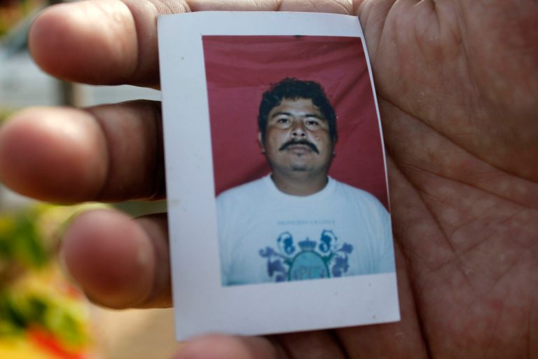 FILE.- In this Feb. 5, 2014 file photo, an unidentified relative of missing journalist Gregorio Jimenez holds a photo of him outside his home in Coatzacoalcos, Mexico. A Mexican official says authorities have found the body of Jimenez who was kidnapped last week from his home in the Gulf Coast state of Veracruz. The official says Gregorio Jimenez's corpse was found Tuesday with two other bodies in the town of Las Choapas. The official spoke on condition of anonymity because he isn't allowed to discuss an investigation that's in progress.(AP Photo/Viridiana Zepeda, File)