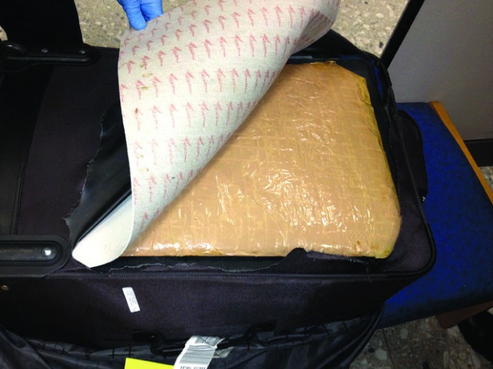 Officials: 11 pounds of heroin found in woman’s suitcase at Dulles