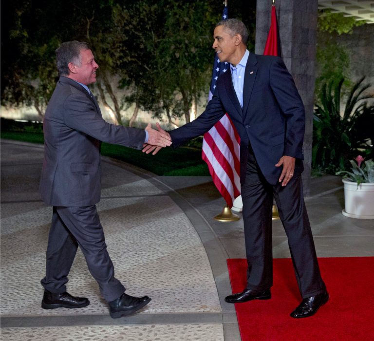 President Barack Obama, right, greets Jordan's King Abdullah II at The Annenberg Retreat at Sunnylands, Rancho Mirage, Calif., Friday, Feb. 14, 2014. (AP Photo/Jacquelyn Martin)