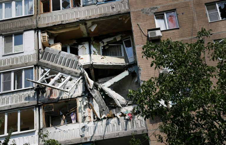 A damaged apartment house is seen after shelling in Donetsk, eastern Ukraine, Wednesday, Aug. 13, 2014. At least three people have been killed in the separatist-controlled city of Donetsk in eastern Ukraine as the government intensifies its shelling campaign. (AP Photo/Sergei Grits)