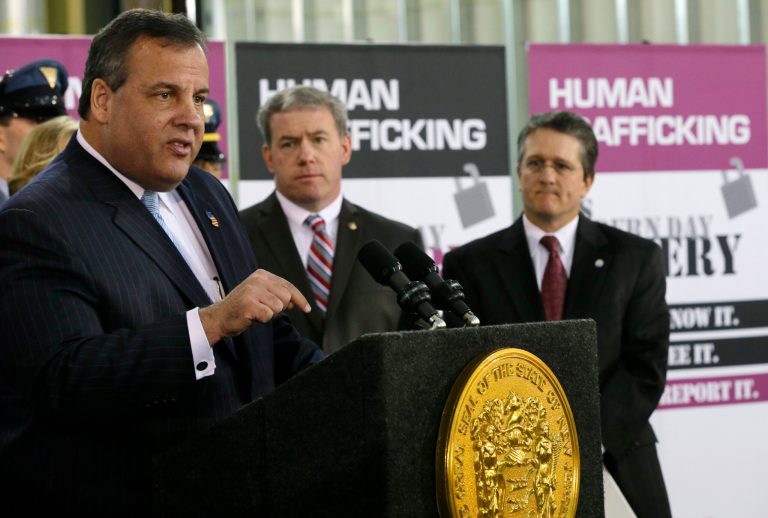 New Jersey Gov. Chris Christie addresses a gathering at the Super Bowl security post Wednesday, Jan. 29, 2014, in East Rutherford, N.J. Christie talked about the effects of human trafficking and police organizations plans to combat it during Super Bowl week. (AP Photo/Mel Evans)