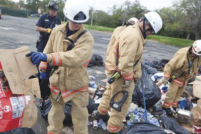 Firemen from Rescue Company 3 in Washington simulate a search and rescue operation at RFK Stadium.-Graeme Jennings/Examiner