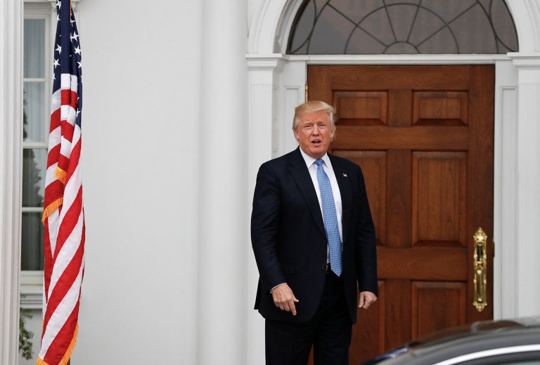 President-elect Donald Trump calls out to media at the Trump National Golf Club Bedminster clubhouse in Bedminster, N.J. (AP Photo/Carolyn Kaster)