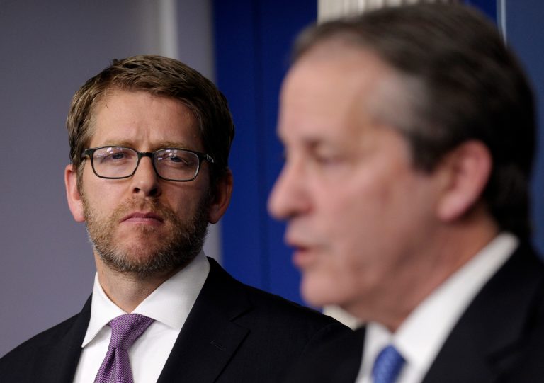 White House press secretary Jay Carney listens at left, as White House National Economic Council Chairman Gene Sperling speaks during the daily briefing at the White House in Washington, Monday, Jan. 6, 2014. With Congress back, the Senate is expected to work on a three-month extension of benefits for the long-term unemployed. (AP Photo/Susan Walsh)