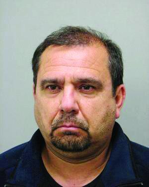 Janitor charged in secret shower video