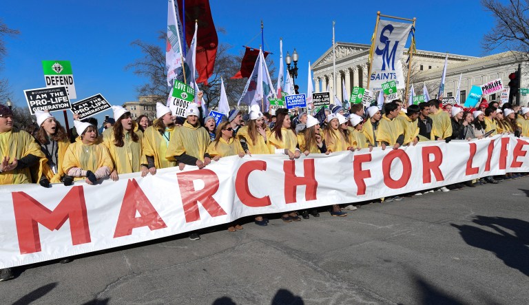 People participate in the March for Life in Washington. The march falls each year around the anniversary of the 1973 Roe v. Wade decision that recognized a legal right to abortion and intends to pressure Congress and the White House to limit legal access to the procedure. (AP Photo/Susan Walsh)
