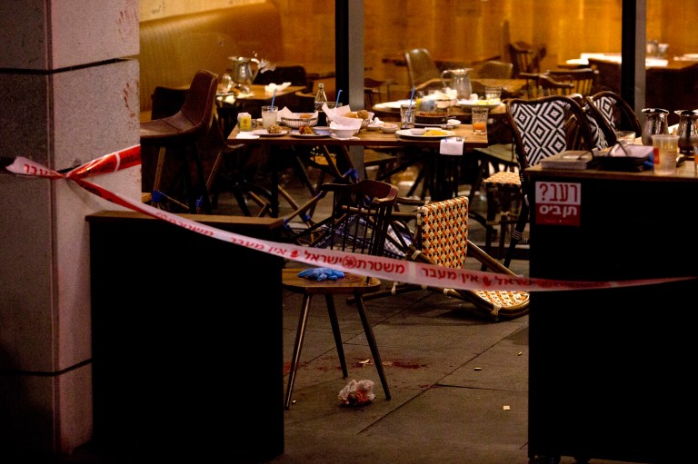 Two Palestinian Arab cousins murdered four Israelis and wounded 16 others in a terrorist attack in a Tel Aviv shopping center, on June 8. (AP Photo/Sebastian Scheiner)