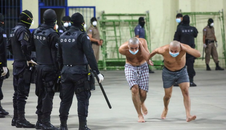Migrants traveling in a group begin their journey toward the U.S. border as they walk along a highway in San Salvador, El Salvador, early Wednesday, Jan. 16, 2019. Migrants fleeing Central America's Northern Triangle region comprising Honduras, El Salvador and Guatemala routinely cite poverty and rampant gang violence as their motivation for leaving.