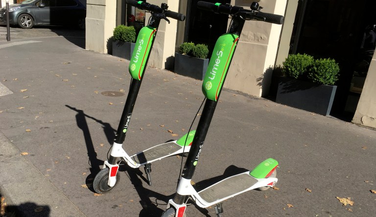 Scooter for sharing park in Paris, Tuesday, July 3, 2018. California-based bicycle sharing service Lime launched a fleet of dock-free electric scooters in Paris. Lime, which operates bike and scooter schemes in about 60 cities and university campuses in the United States, has already launched operations in the German cities of Berlin and Frankfurt and in Zurich, Switzerland.