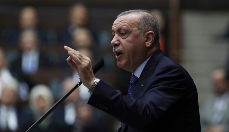 Turkish President Recep Tayyip Erdogan addresses his ruling party legislators at the Parliament, in Ankara, Wednesday, Oct 16, 2019. Erdogan called Wednesday on Syrian Kurdish fighters to leave a designated border area in northeast Syria 'as of tonight' for Turkey to stop its military offensive, defying pressure on him to call a ceasefire and halt its incursion into Syria.