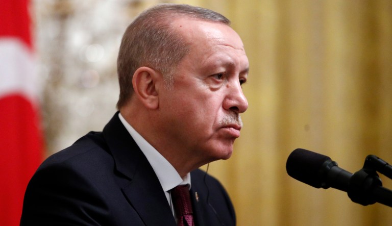 Turkish President Recep Tayyip Erdogan listens during a news conference with President Donald Trump in the East Room of the White House, Wednesday, Nov. 13, 2019, in Washington.