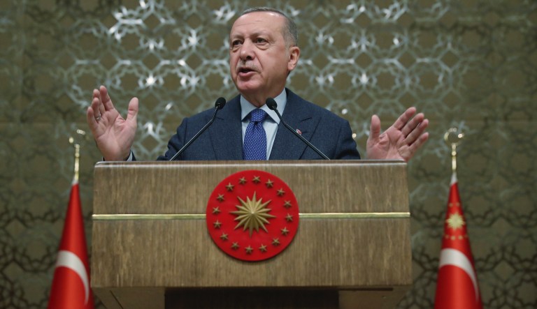 Turkey's President Recep Tayyip Erdogan speaks during a meeting at his palace, in Ankara, Turkey, Thursday, Dec. 12, 2019. Ahmet Davutoglu, a former Turkish prime, who had served as foreign minister between 2009 and 2014 and later as prime minister until 2016, has established a new political party on Thursday in a move that could dent support for President Recep Tayyip Erdogan's ruling party.