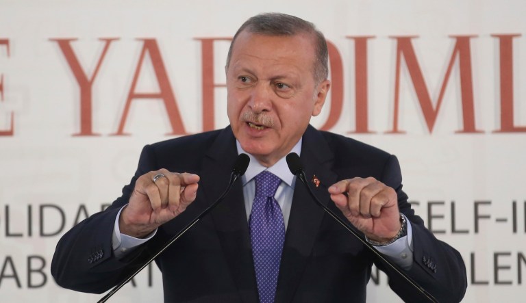 Turkish President Recep Tayyip Erdogan addresses an African Muslim Religious Leaders Summit, in Istanbul, Saturday, Oct. 19, 2019. Turkey's Interior Minister Suleyman Soylu says 41 suspected Islamic State members were re-captured after fleeing a detention camp earlier this week in Syria, and Erdogan has accused Syrian Kurdish forces of releasing some 750 IS members and families, amid Turkey's offensive.