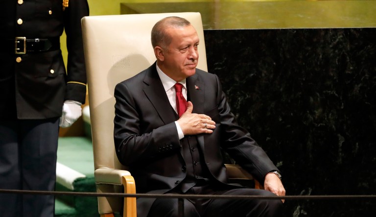 Turkey's President Recep Tayyip Erdogan taps his heart as he waits to address the 74th session of the United Nations General Assembly, Tuesday, Sept. 24, 2019.