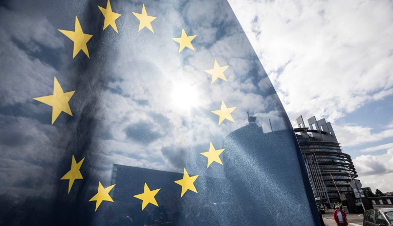 An EU flag flies at the front of the European Parliament building in Strasbourg, France, Tuesday March 26, 2019. The European Parliament is furiously debating the pros and cons of a landmark copyright bill one last time before the legislature will vote on it later.