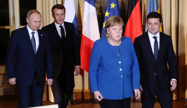 French President Emmanuel Macron, second left, Russian President Vladimir Putin, left, German Chancellor Angela Merkel and Ukrainian President Volodymyr Zelenskiy arrive for a working session at the Elysee Palace Monday, Dec. 9, 2019 in Paris.