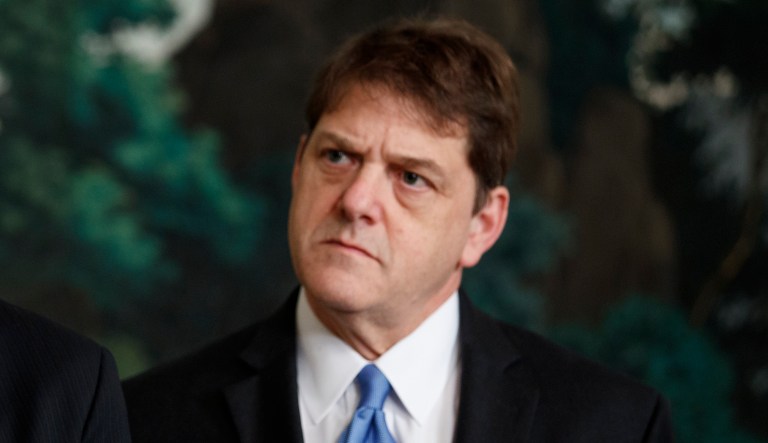 White House trade adviser Peter Navarro, left, and Deputy Assistant to the President for International Economic Affairs Everett Eissenstat listen as President Donald Trump speaks before signing a presidential memorandum imposing tariffs and investment restrictions on China, in the Diplomatic Reception Room of the White House, Thursday, March 22, 2018, in Washington.