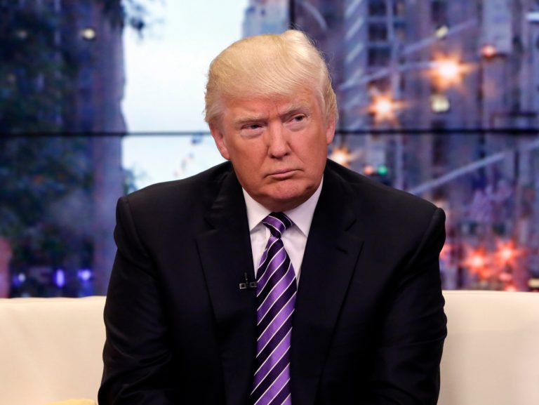 This Sept. 16, 2013 photo, Donald Trump appears on the 