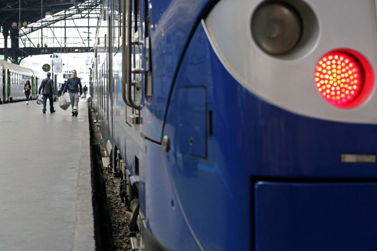 A Regional Express Train, or TER, is sationed along a platform at the Saint Lazare station in Paris, Wednesday May 21, 2014. Engineers at the French railway network forgot to measure the actual distance between lines and platforms, before ordering 341 new trains, which were to be introduced between now and 2016. It will cost 50 million euros ($68 million) to fix the problem. Nearly 1,300 stations are just a few centimeters (inches) too narrow. (AP Photo/Remy de la Mauviniere)