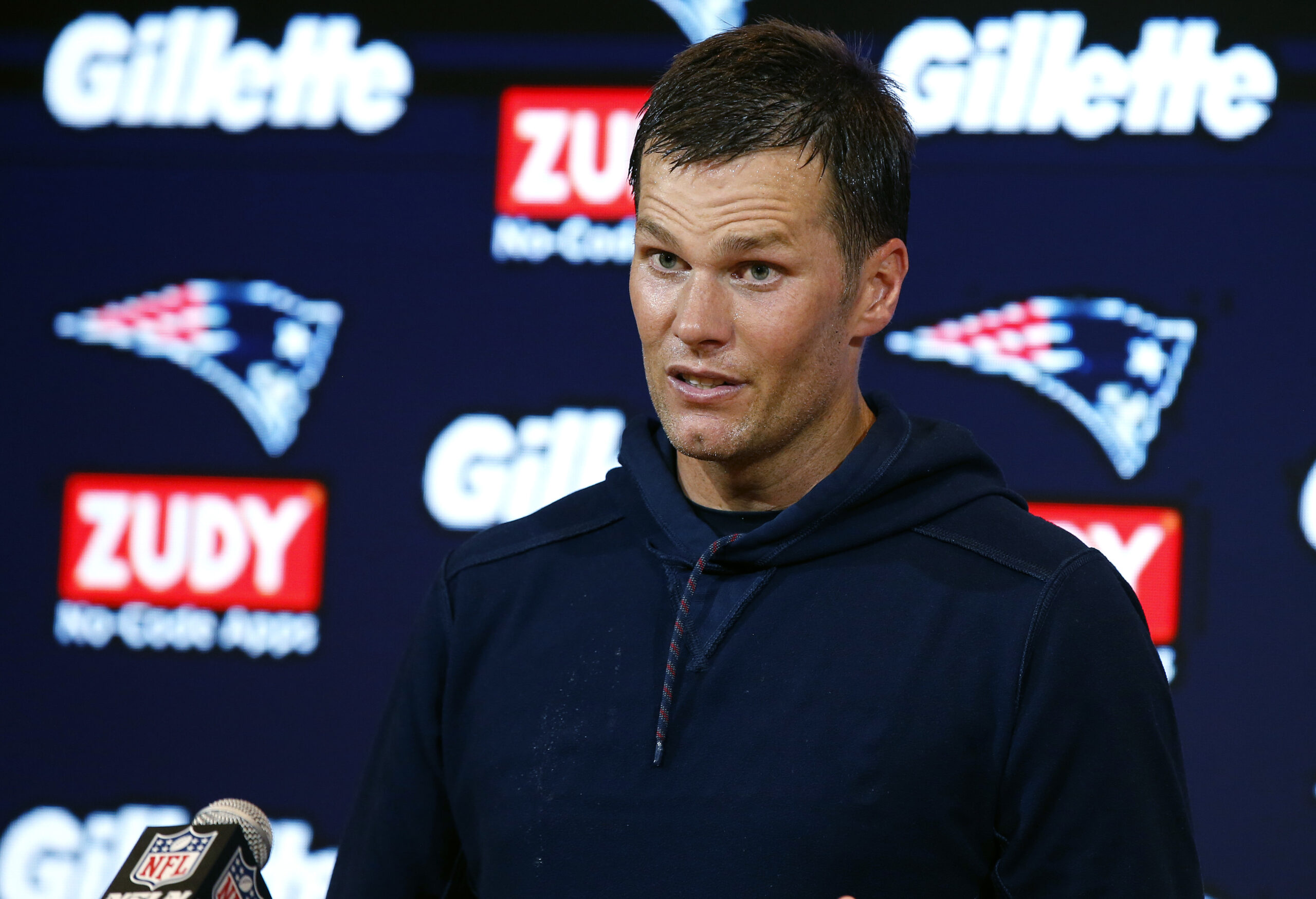 Trump’s friend Tom Brady steers clear of politics after linking arms with teammates
