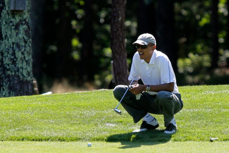President Obama lines up a putt on the first green on August 9, in Oak Bluffs, Mass. (Getty images/Matthew Healey)