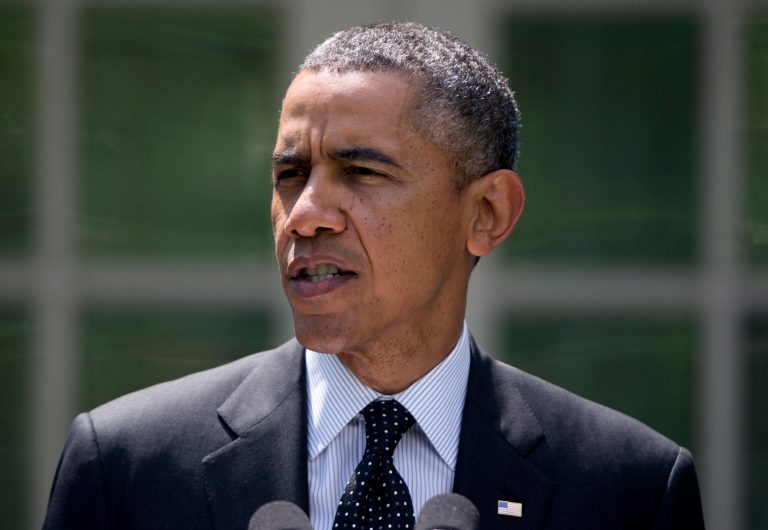 President Barack Obama speaks about the future of US troops in Afghanistan, Tuesday, May 27, 2014, in the Rose Garden of the White House in Washington. The president will seek to keep 9,800 US troops in Afghanistan after the war formally ends later this year and then will withdraw most of those forces by the end of 2016. (AP Photo/Carolyn Kaster)
