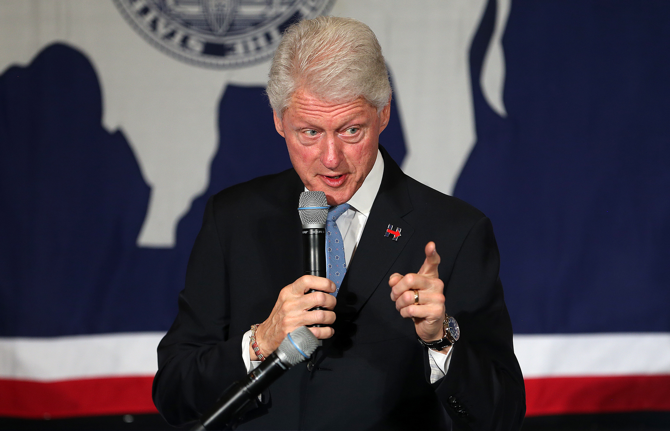 ‘Never-before-seen photos’ show Bill Clinton receiving neck massage from Epstein accuser during humanitarian trip