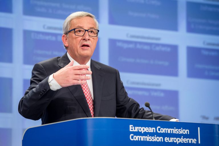 European Commission President elect Jean-Claude Juncker gestures as he addresses the media on the attribution of portfolios to the Commissioners-designate at the European Commission headquarters in Brussels on Wednesday, Sept. 10, 2014. (AP Photo/Geert Vanden Wijngaert)
