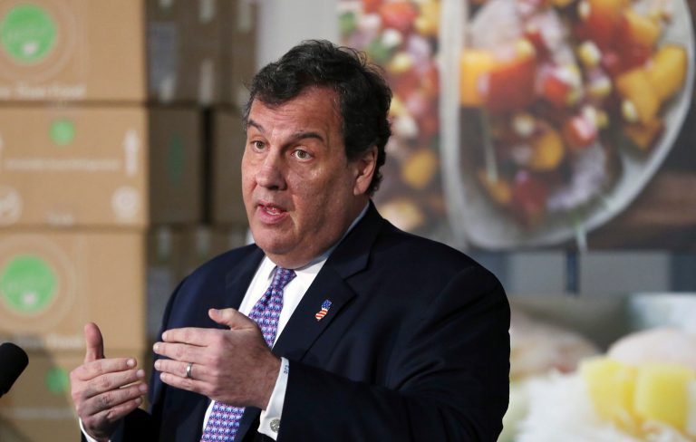 Christie, who has struggled with his weight, was caught Friday in an unflattering maneuver. (AP Photo/Mel Evans)