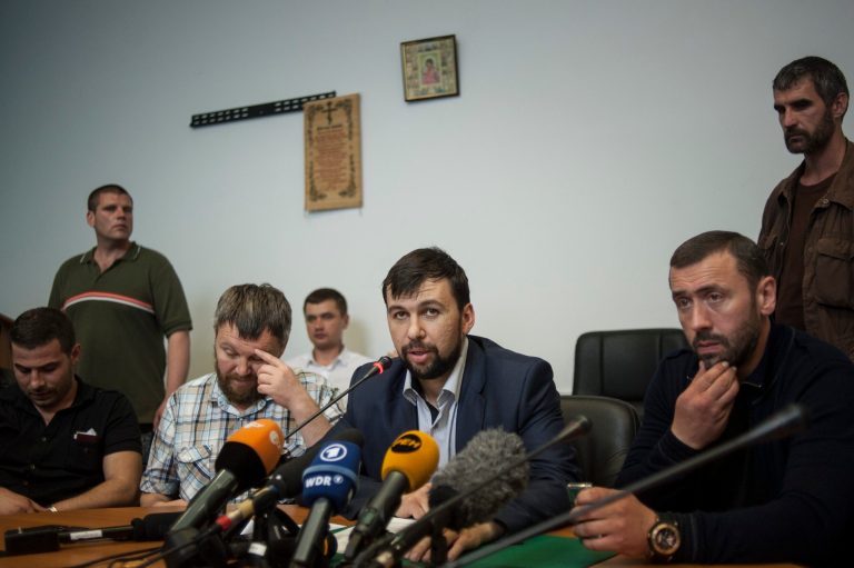Denis Pushilin, center, a leader of the insurgency that has declared an independent 